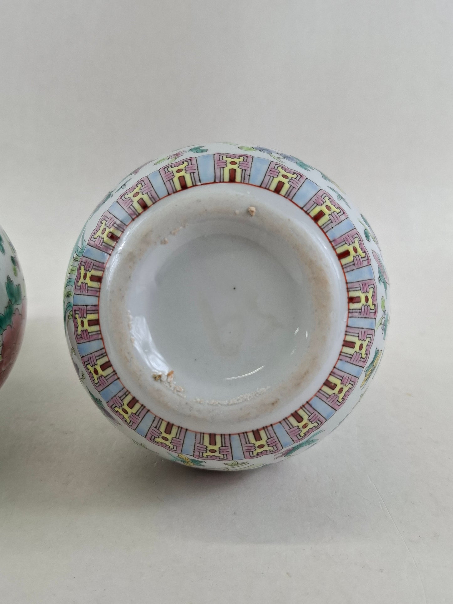 Set of 2 Chinese famille rose bottle vases decorated with flowers and butterflies // 20th century