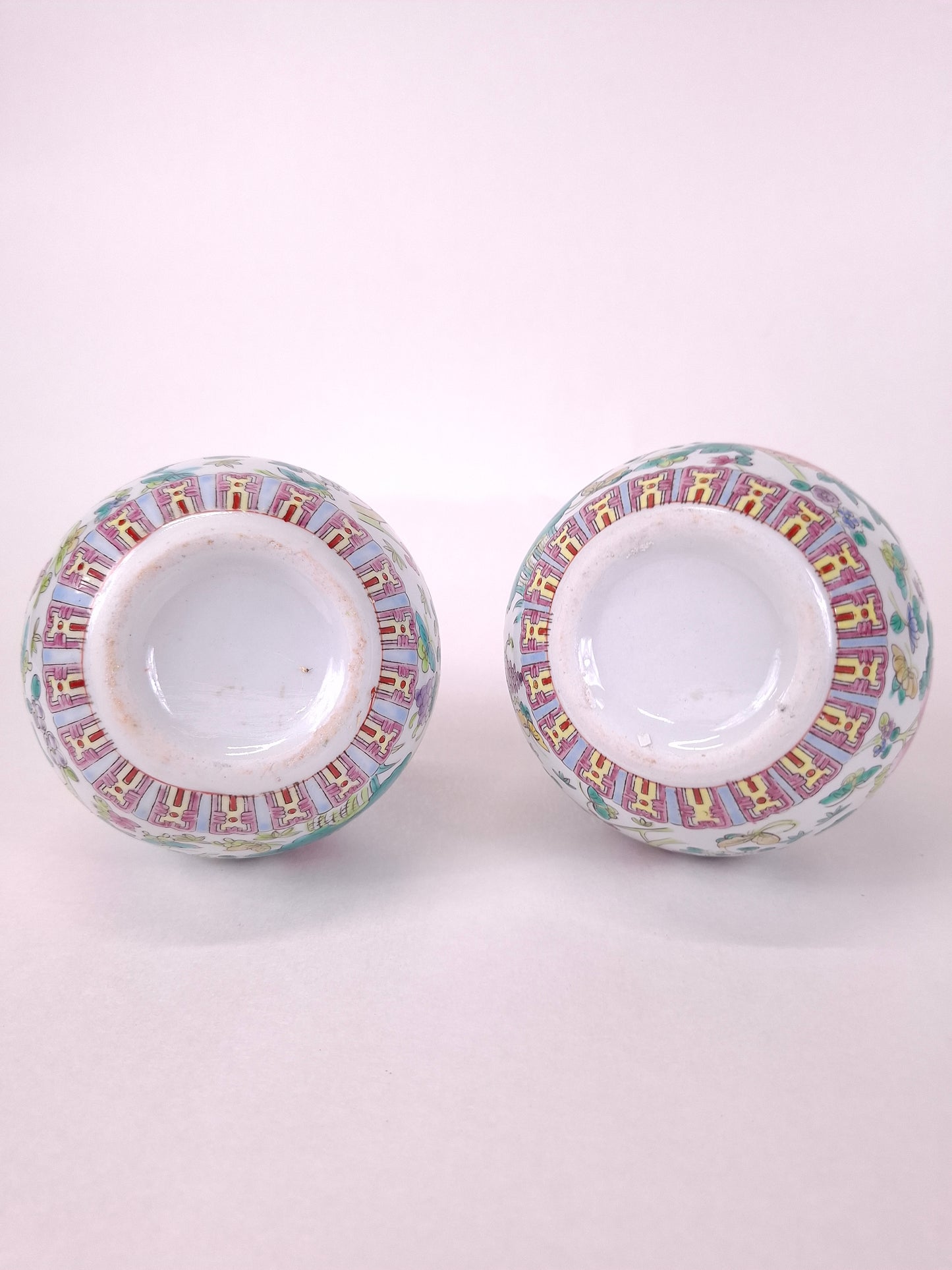 Set of 2 Chinese famille rose bottle vases decorated with flowers and butterflies // 20th century