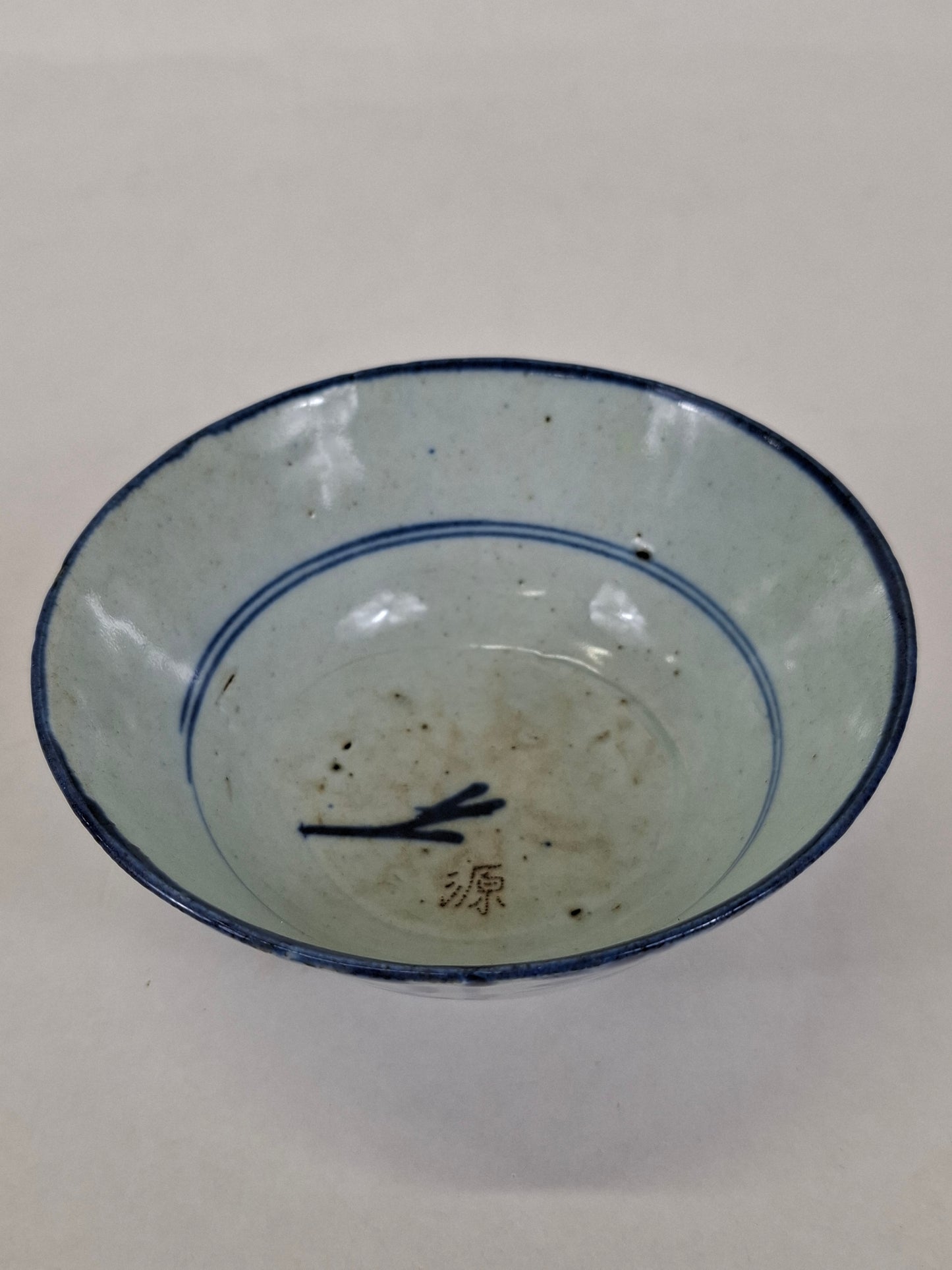 Upside of a 17th century Ming blue nd white porcelain hand painted bowl