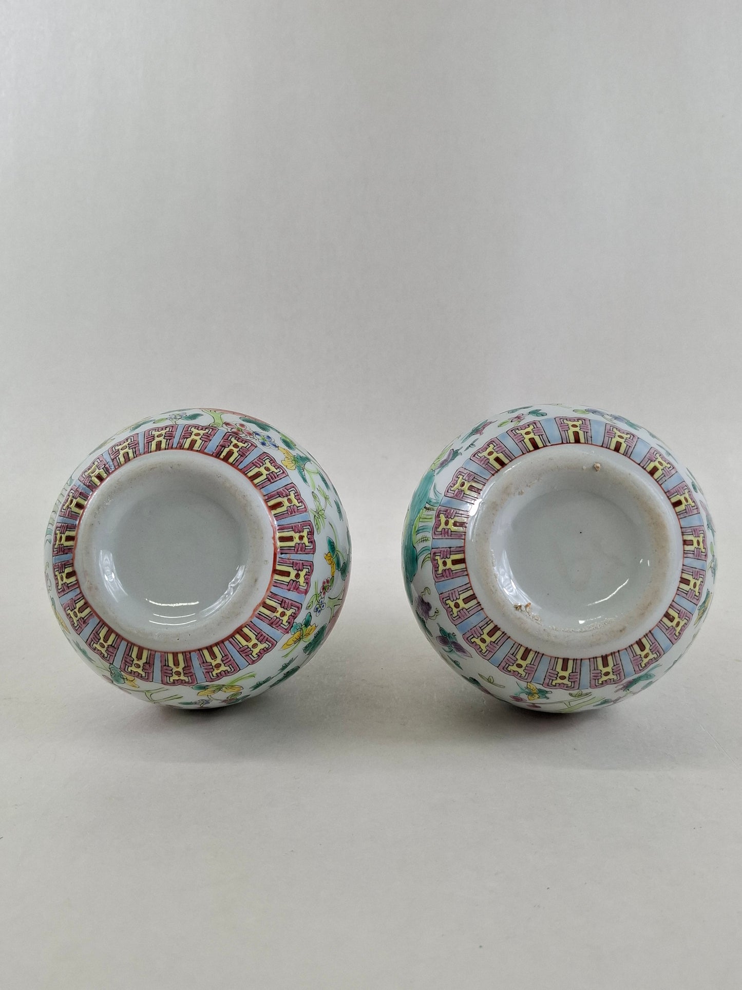 Set of 2 Chinese famille rose bottle vases decorated with flowers and butterflies // 20th century