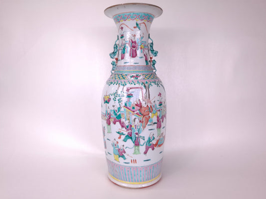 Antique handmade Chinese famille rose vase with colorful festive patterns on a white background
