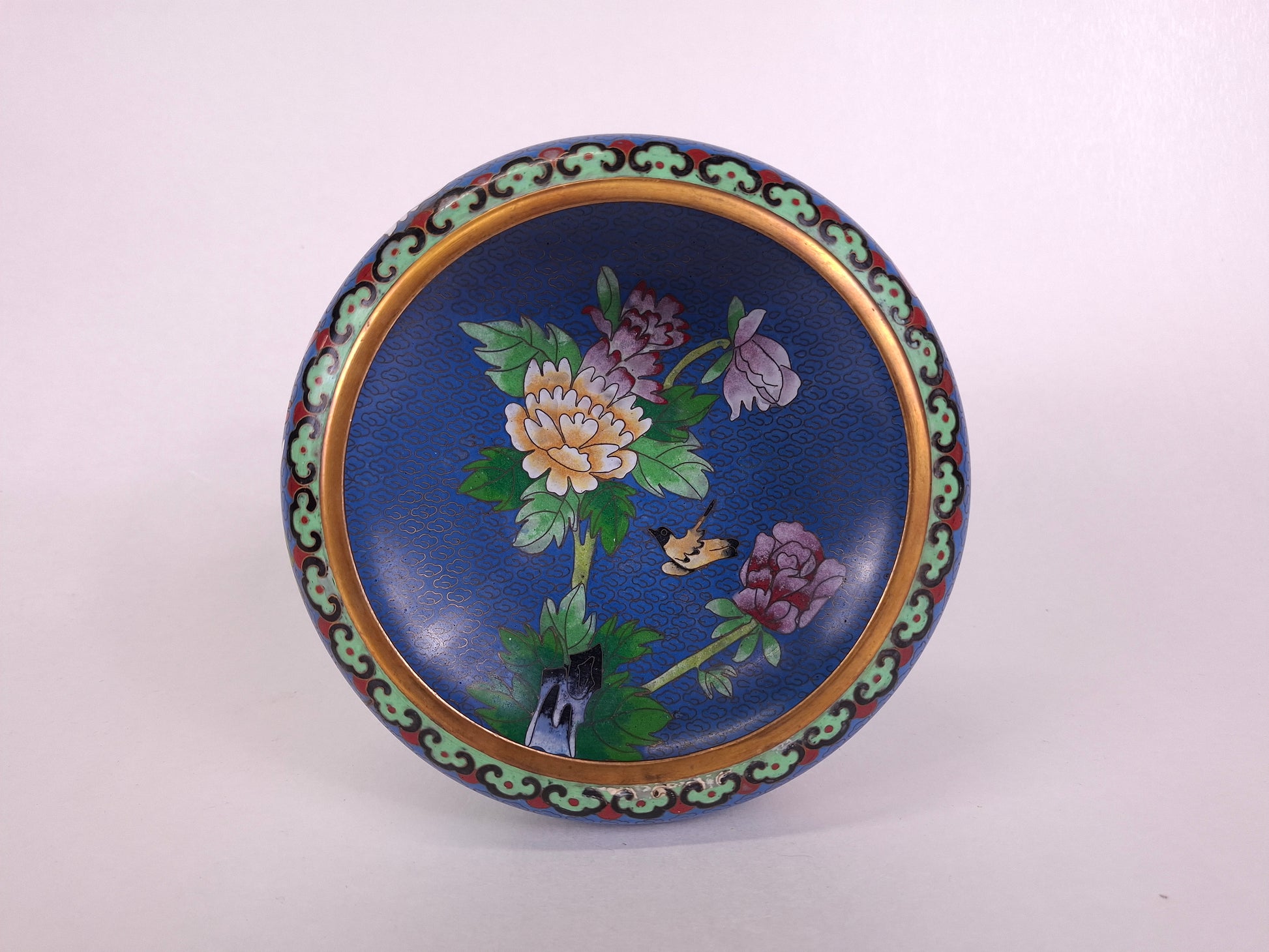 Handmade Chinese cloisonne Jingfa incence burner with flowers and butterfly on a blue background