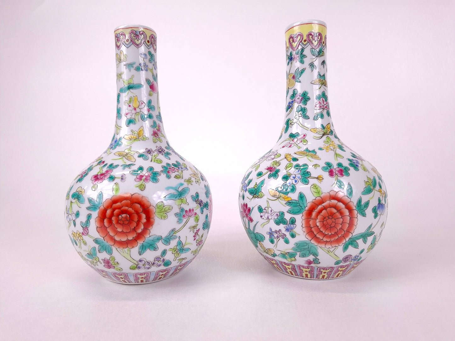 Set of 2 Chinese famille rose bottle vases decorated with flowers and butterflies // 20th century