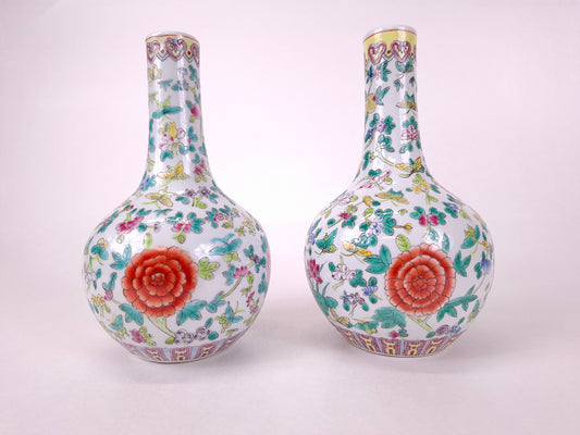 Set of 2 Chinese famille rose bottle vases decorated with flowers and butterflies // 20th century