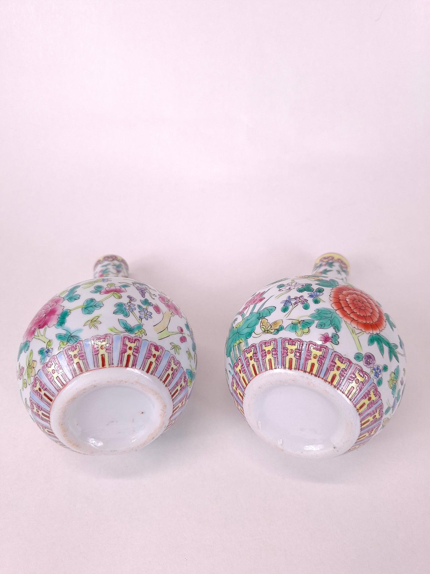 Set of 2 Chinese famille rose bottle vases decorated with flowers and butterflies // 20th century