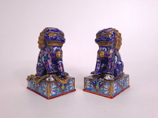 Pair of Chinese cloisonne foo dog guardian lions with flower patterns

