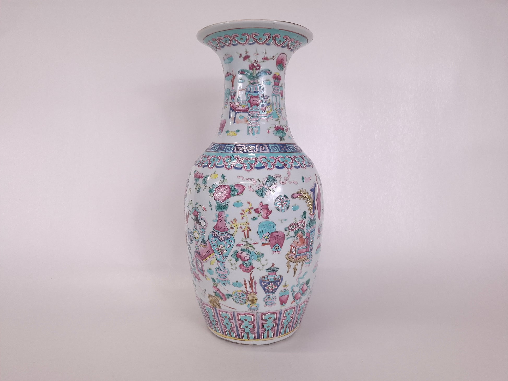 A tall handmade antique Chinese 19th century famille rose vase with 100 treasures