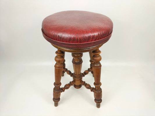 Vintage French adjustable wooden piano stool with red leather seat