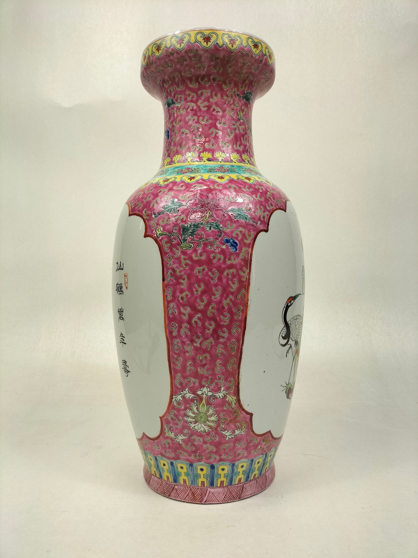 Chinese famille rose fencai vase decorated with lady and child surrounded with crane and bat // 20th century