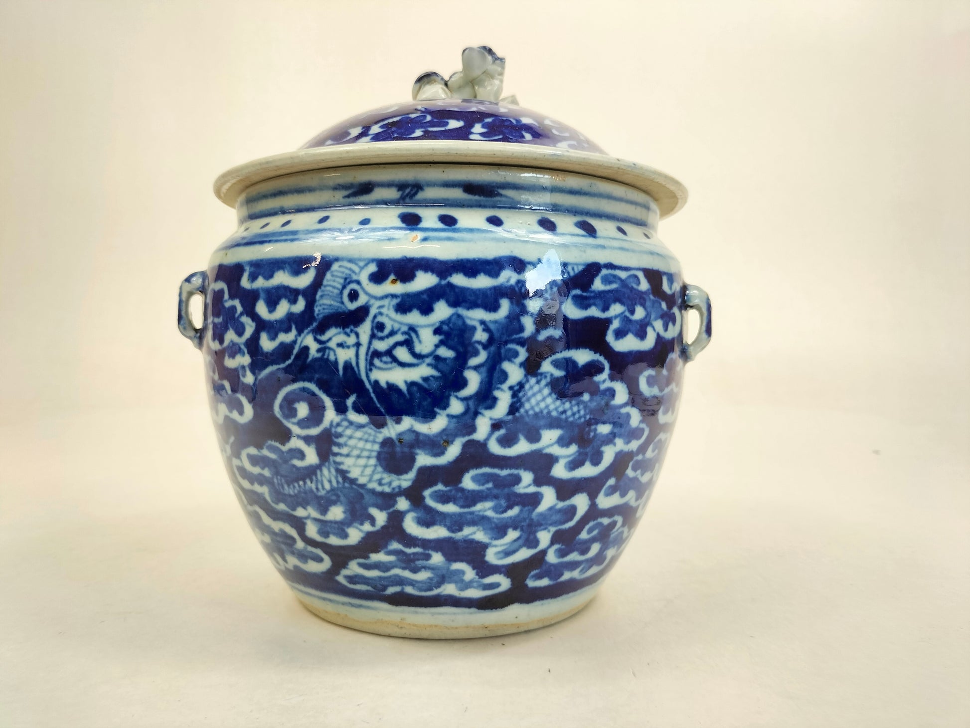 Antique 19th century Chinese blue white lidded jar with dragon and clouds